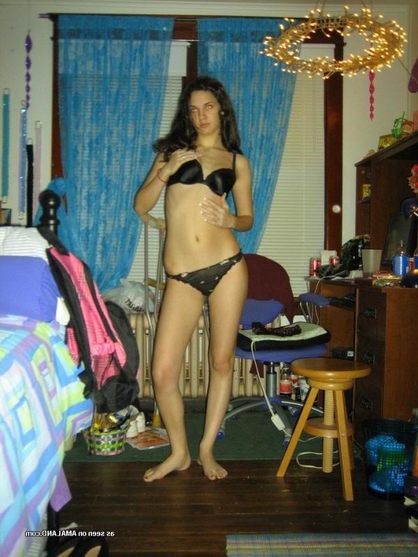 10P Brunette babe posing topless in her bedroom