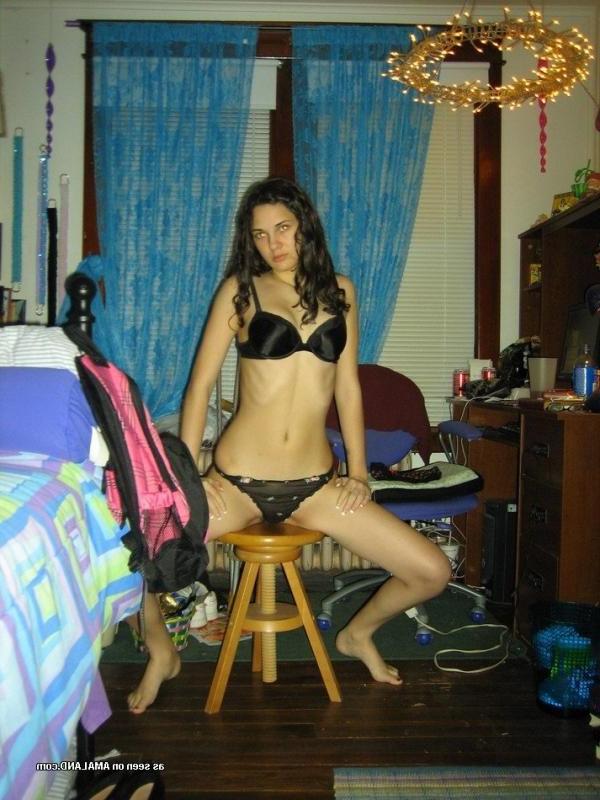 10P Brunette babe posing topless in her bedroom