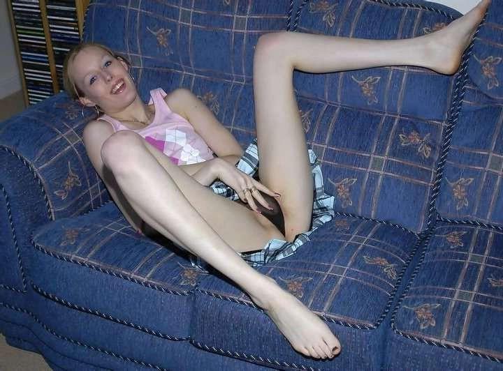 16P Skinny chick plays with her dildo on the couch
