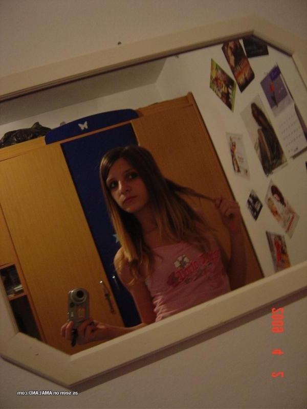 14P Sexy amateur chick camwhoring inside her bedroom