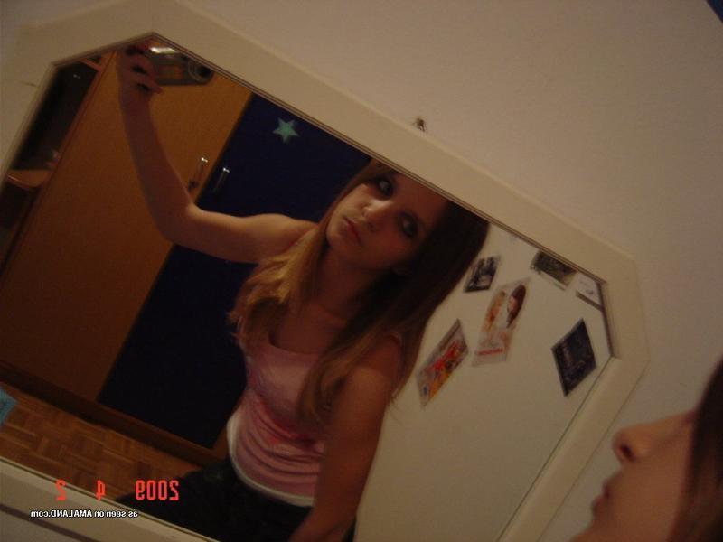14P Sexy amateur chick camwhoring inside her bedroom