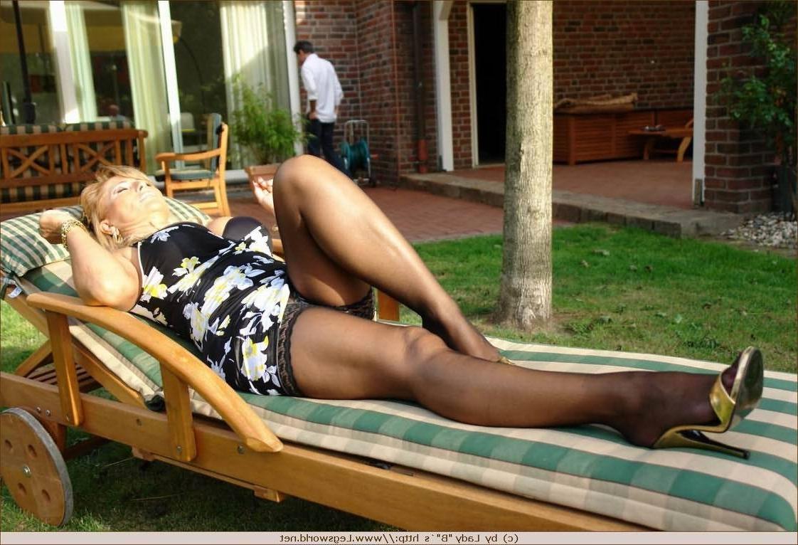 12P Amateur lady displaying her stocking legs on the sun