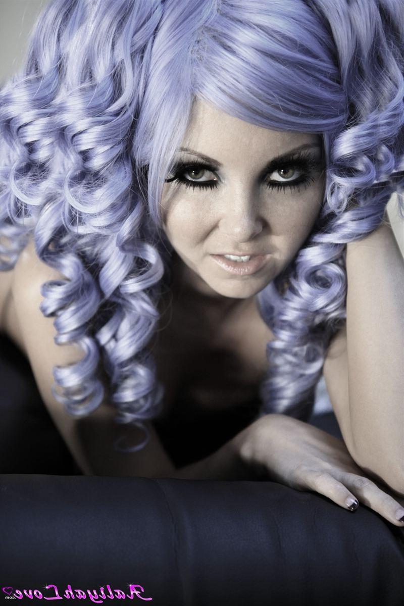 16P Aaliyah Love poses in a purple wig and sheer stockings