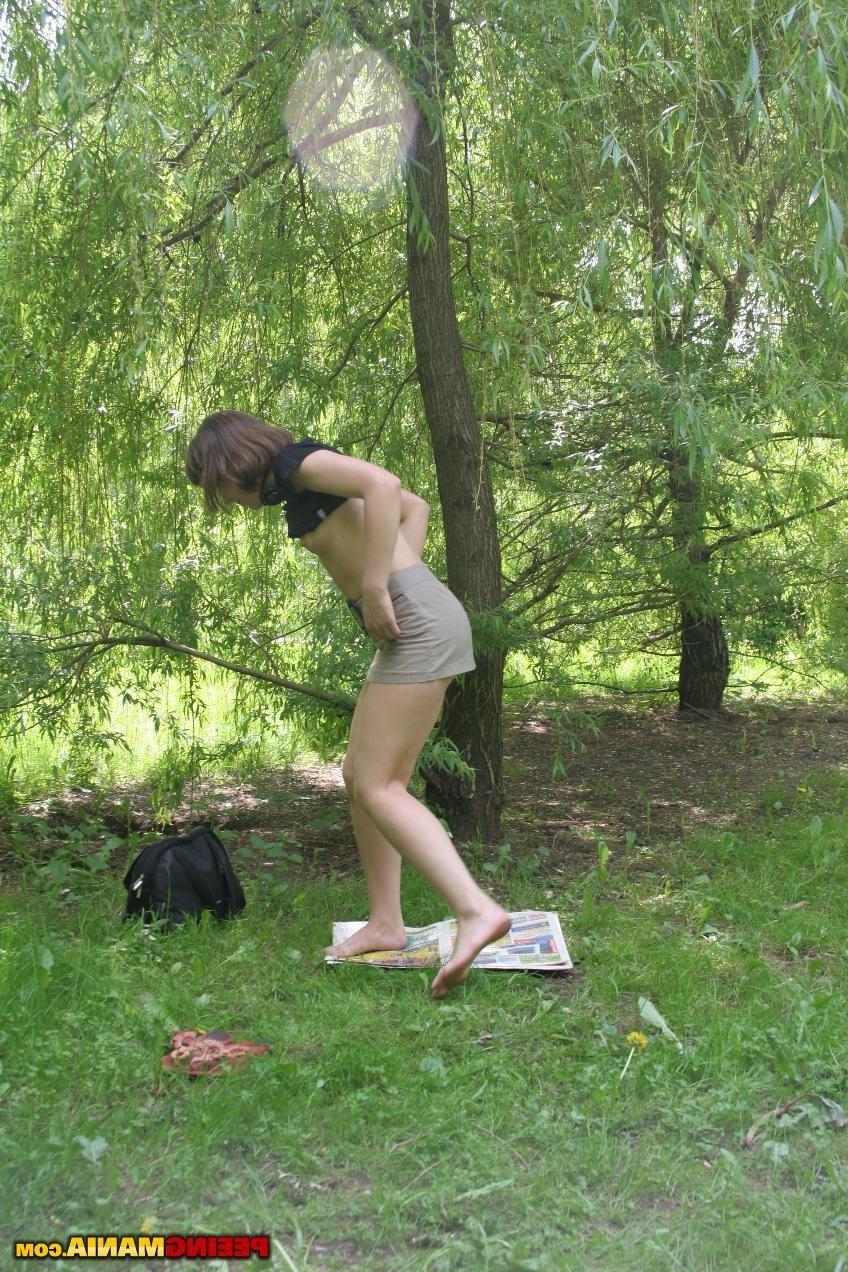 15P Bitchy miss pulls down her knicks and pees on a newspaper in the woods