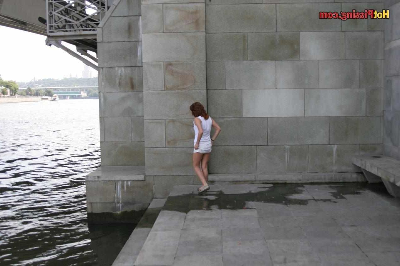 15P Slut pissing outdoors