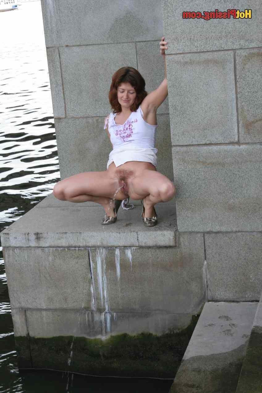 15P Slut pissing outdoors