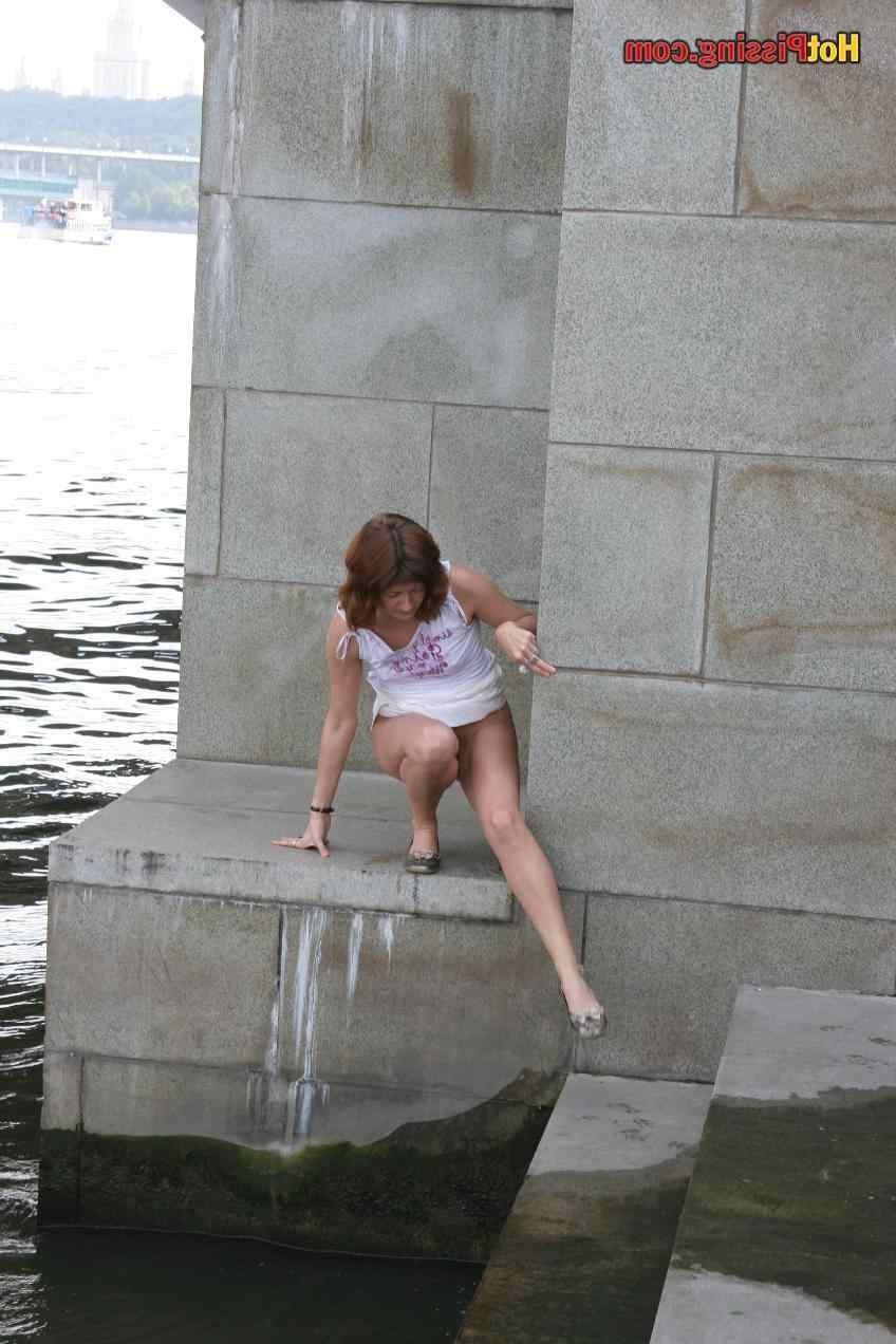 15P Slut pissing outdoors