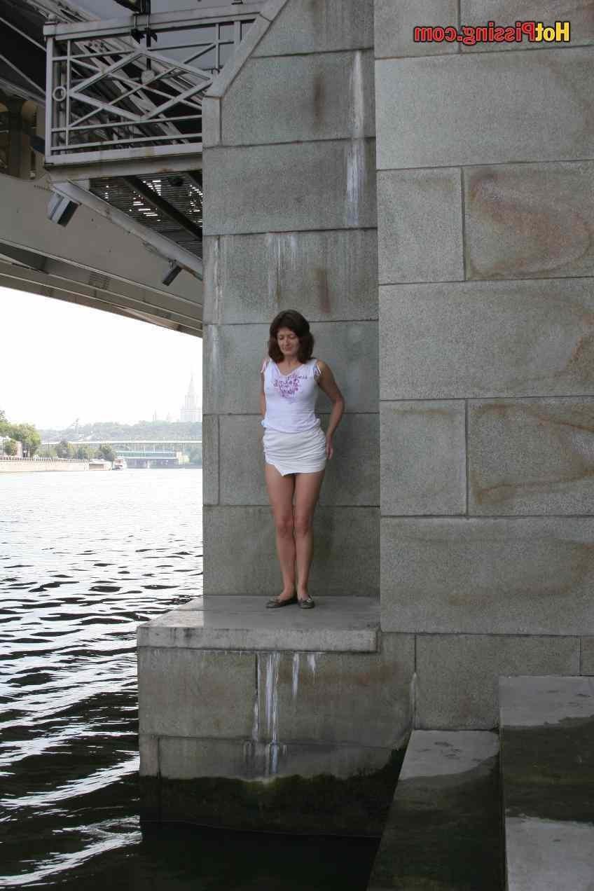 15P Slut pissing outdoors