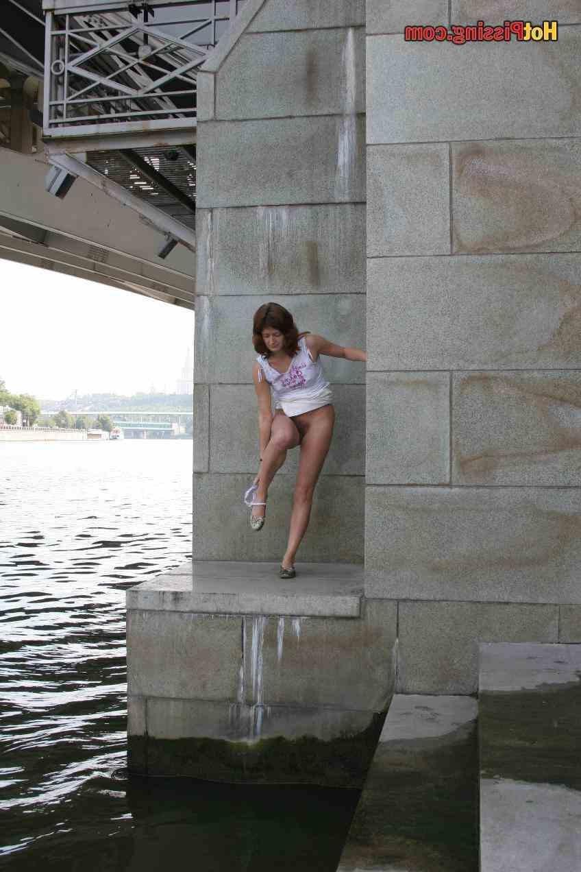 15P Slut pissing outdoors