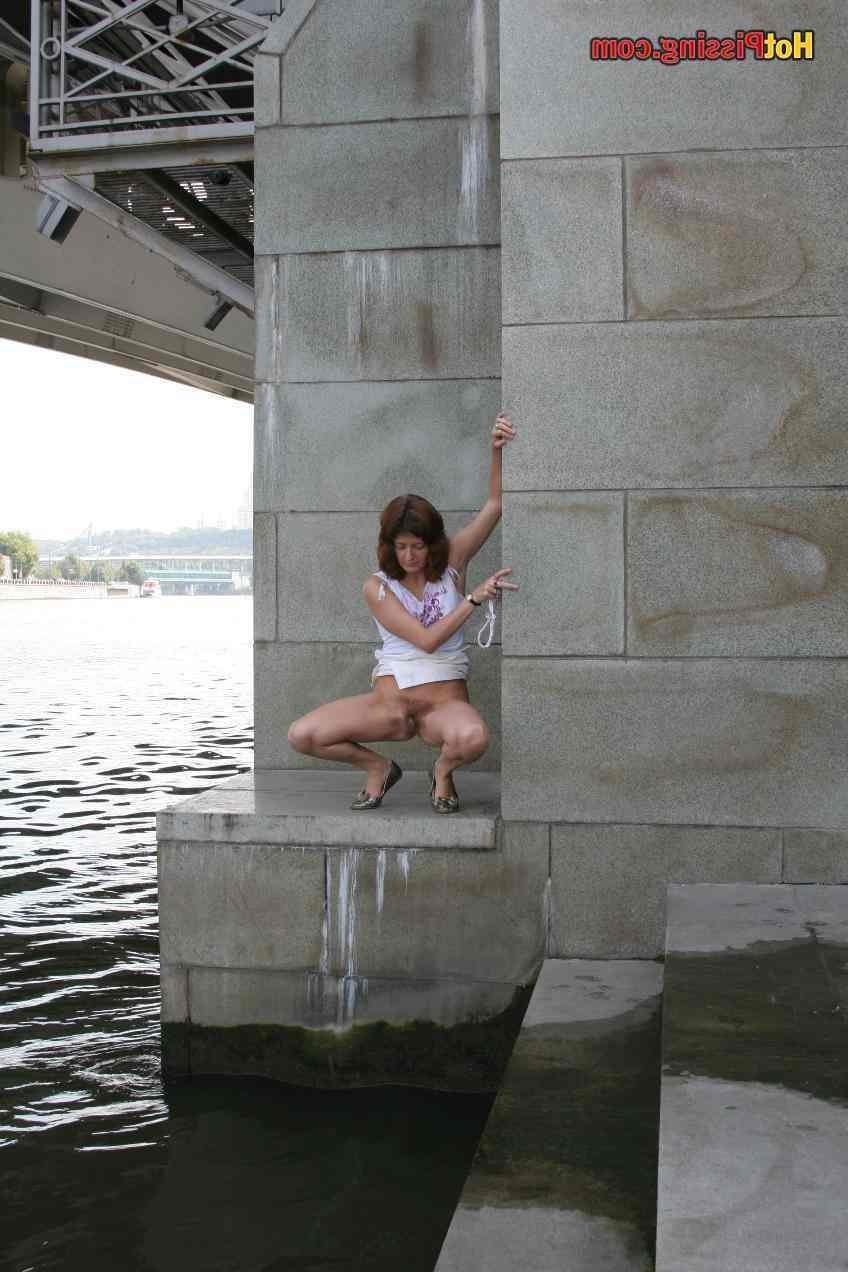 15P Slut pissing outdoors
