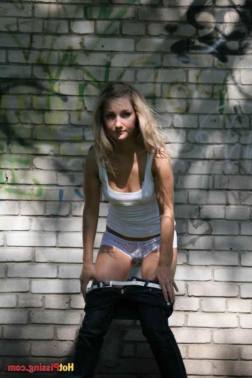 15P Slut pissing outdoors