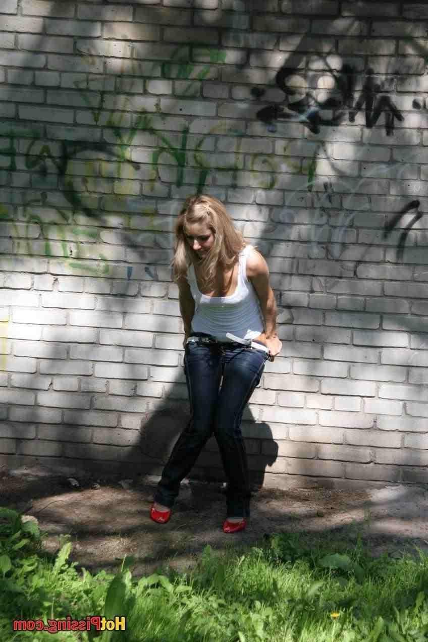 15P Slut pissing outdoors