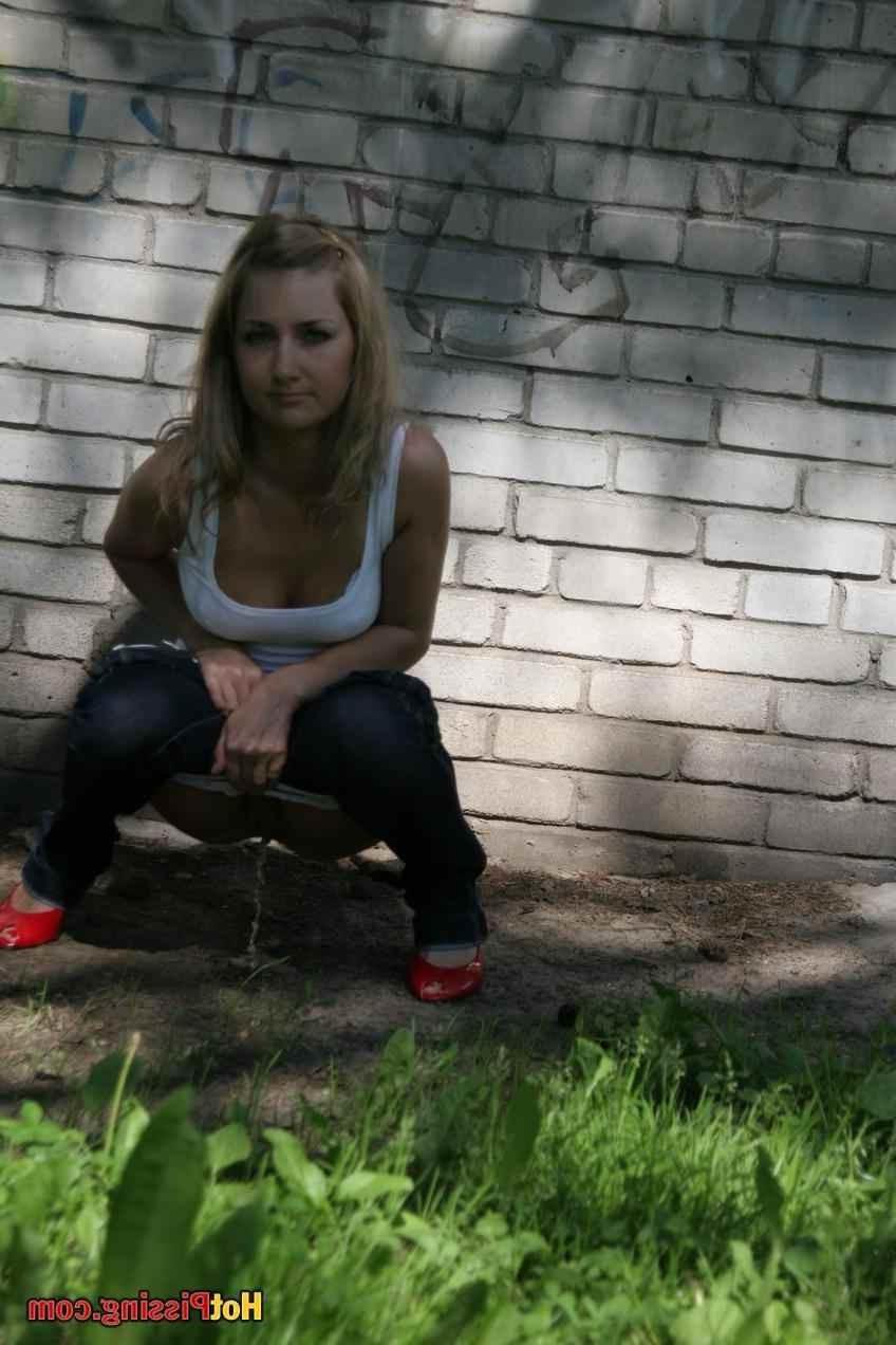 15P Slut pissing outdoors