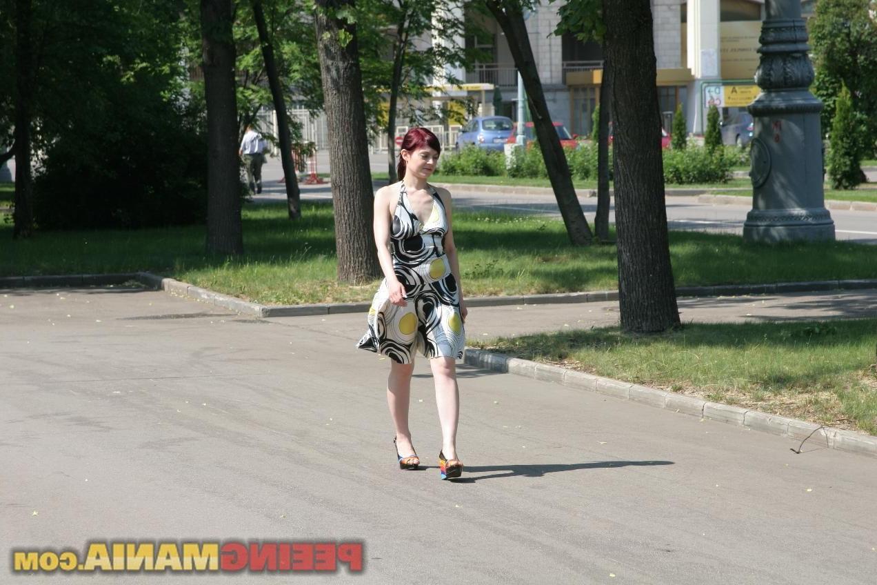 15P A huge piss puddle done by a redhead minx in a summer dress outdoors