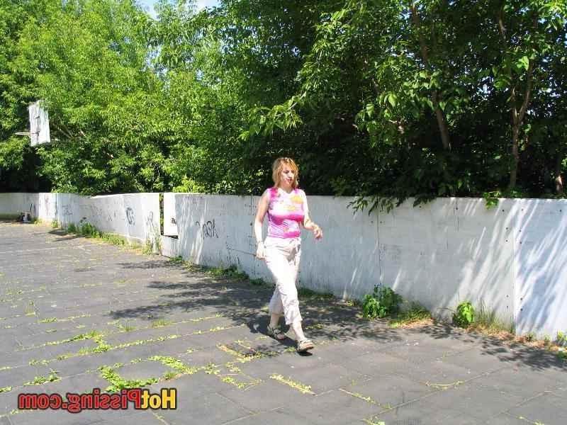 15P Slut pissing outdoors
