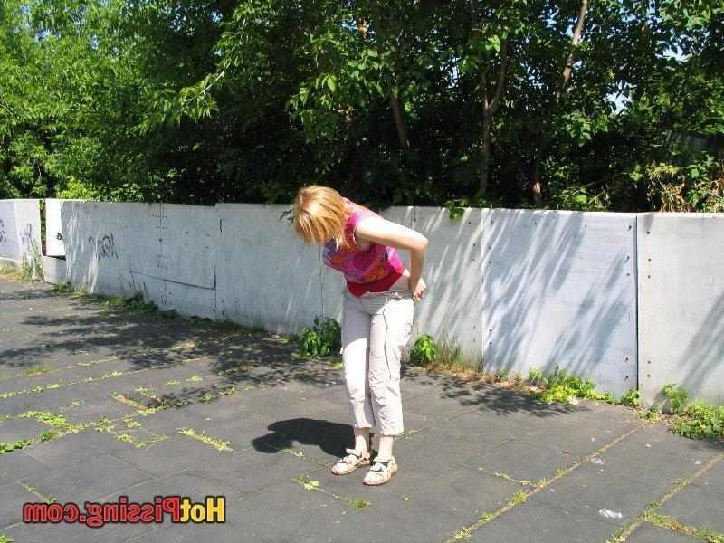 15P Slut pissing outdoors