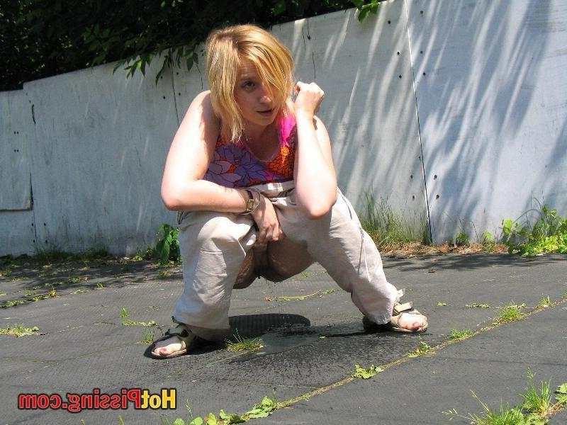 15P Slut pissing outdoors