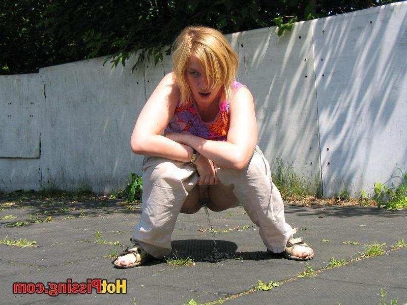 15P Slut pissing outdoors