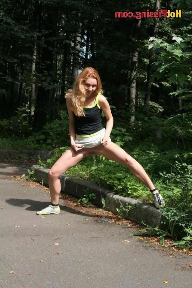 15P Slut pissing in the street