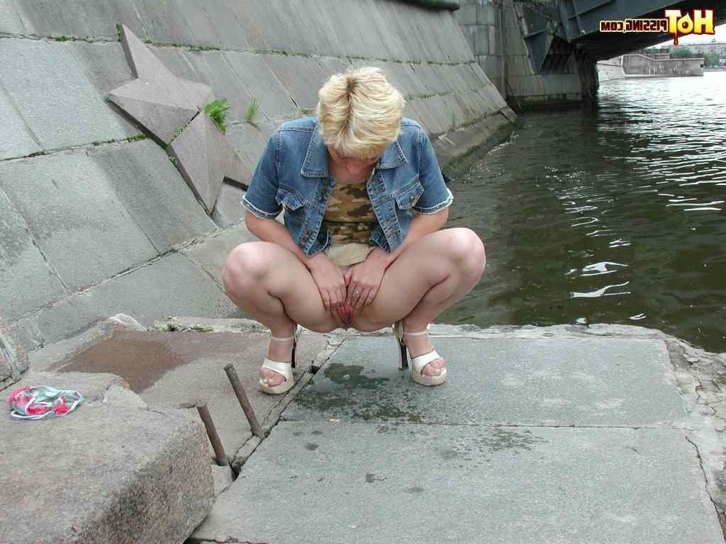 15P Slut pissing outdoors