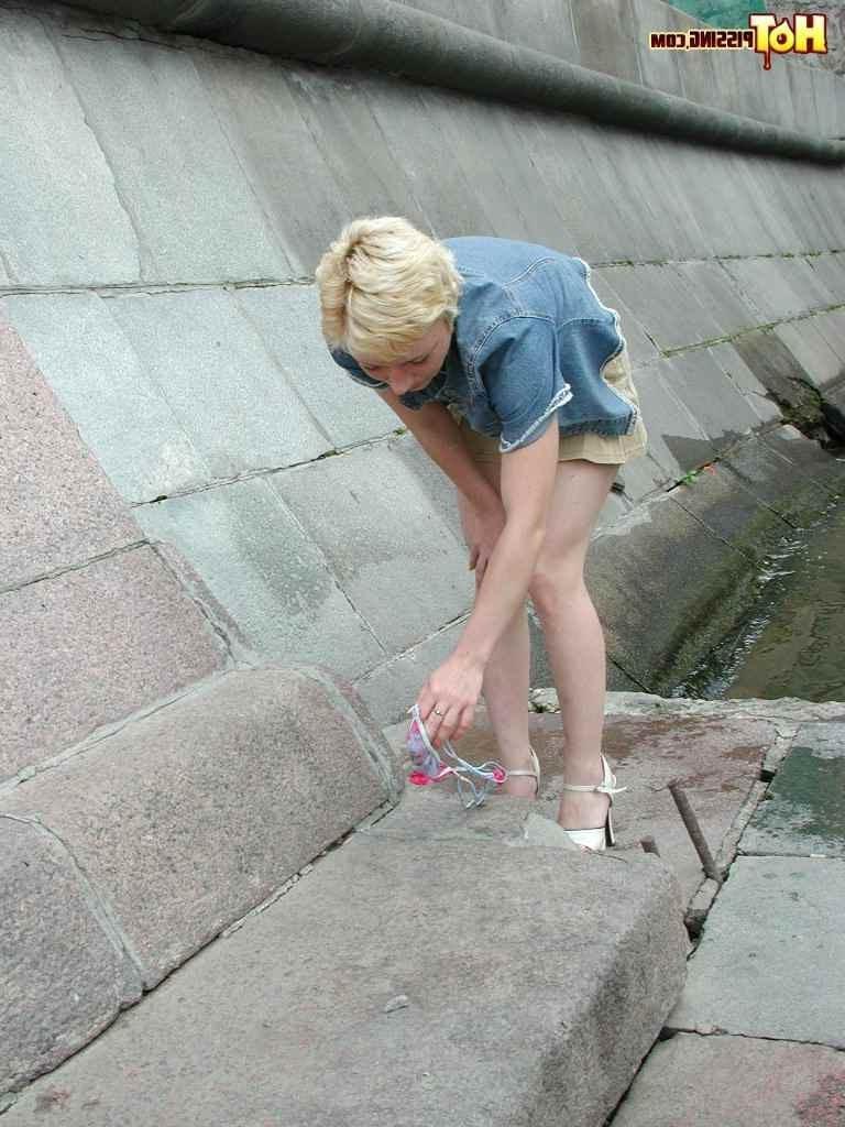 15P Slut pissing outdoors