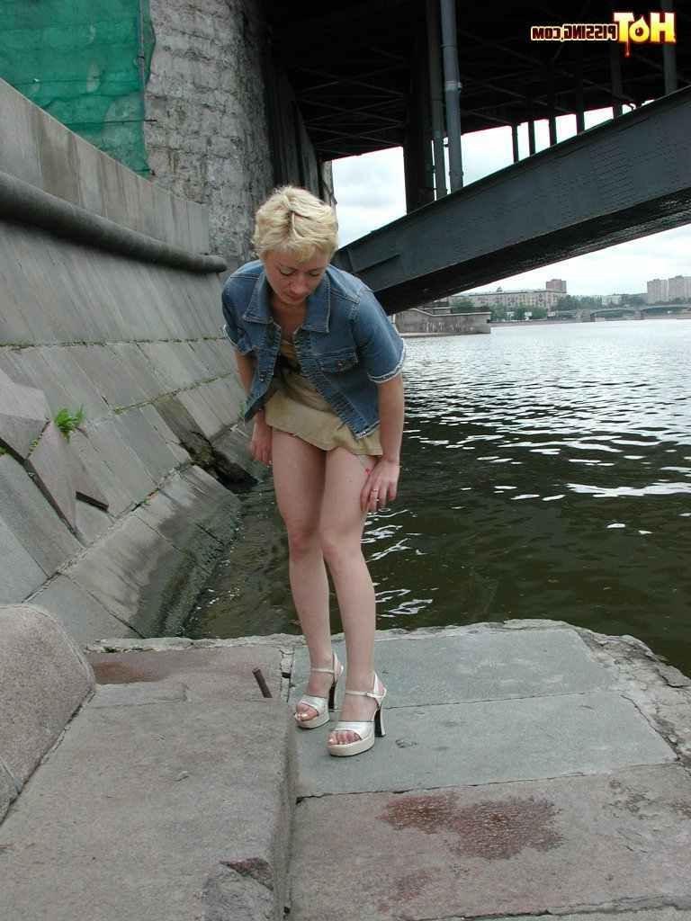 15P Slut pissing outdoors