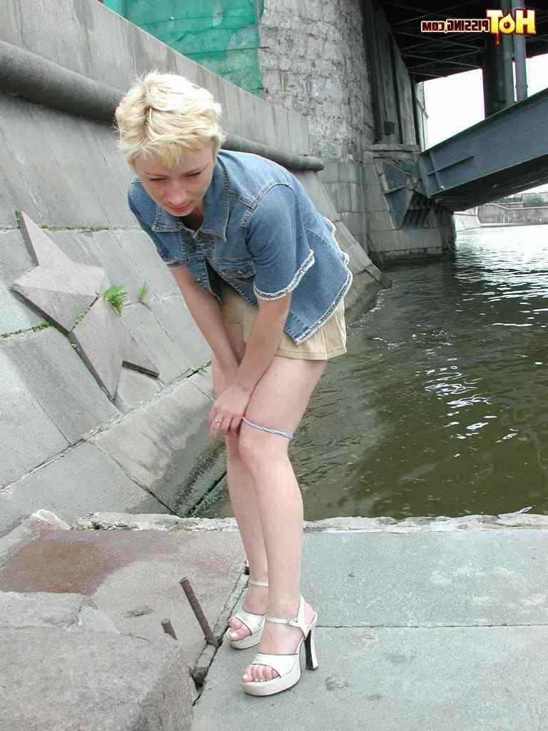 15P Slut pissing outdoors