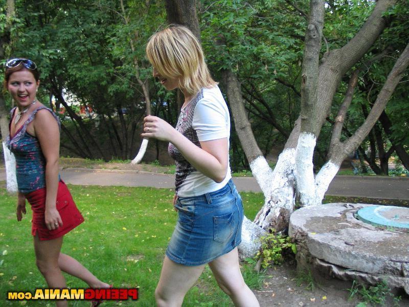 11P Girls pull the panties aside to empty their bladders on the big stone