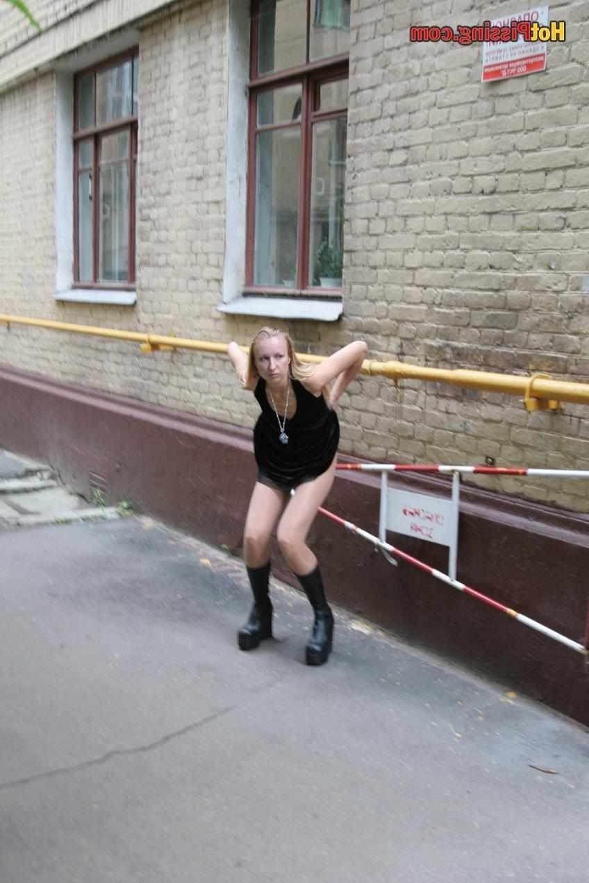 15P Slut pissing outdoors