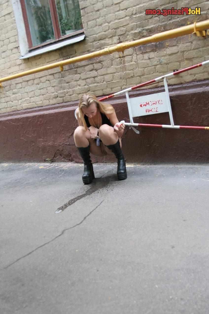 15P Slut pissing outdoors