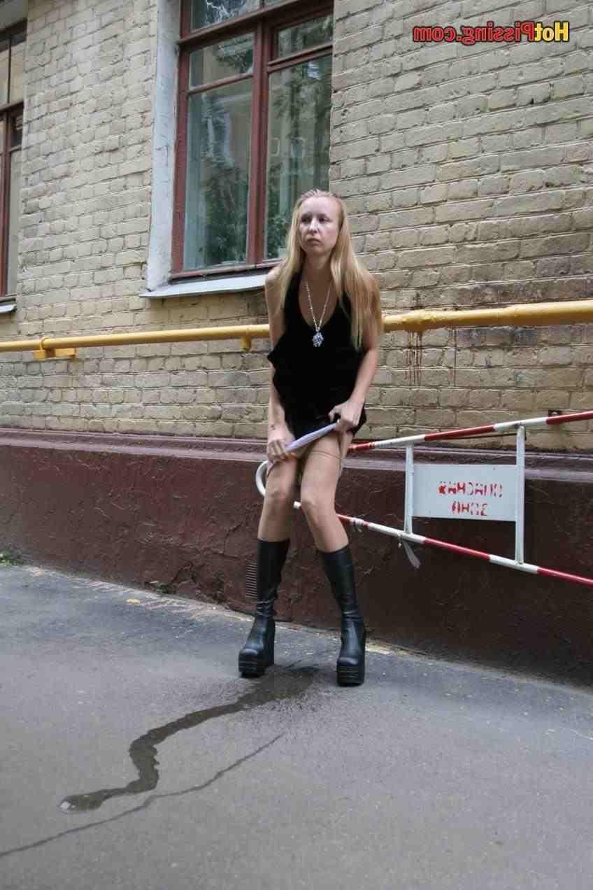 15P Slut pissing outdoors