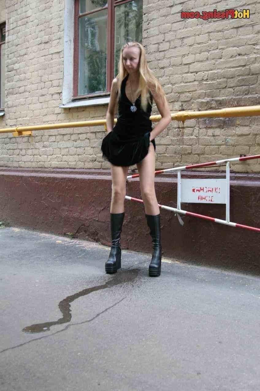 15P Slut pissing outdoors