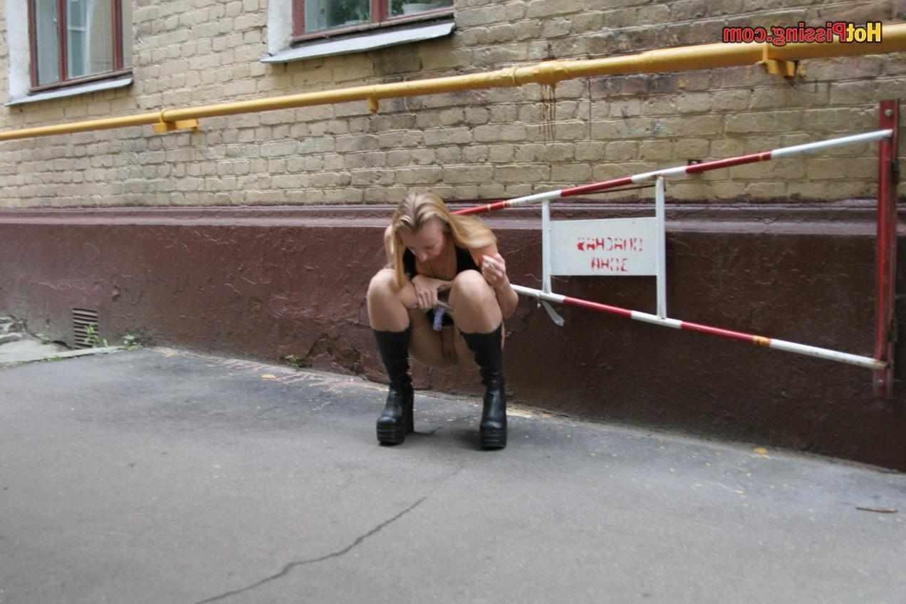 15P Slut pissing outdoors