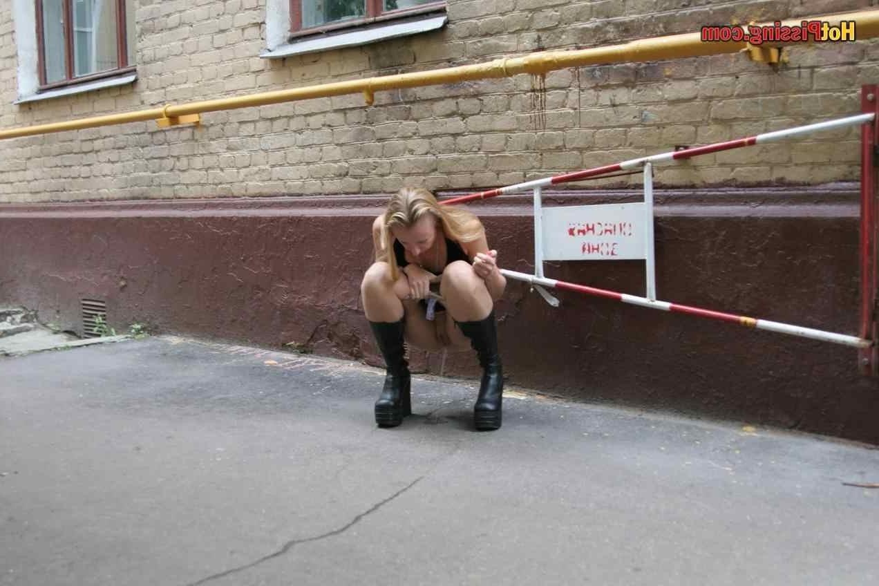 15P Slut pissing outdoors