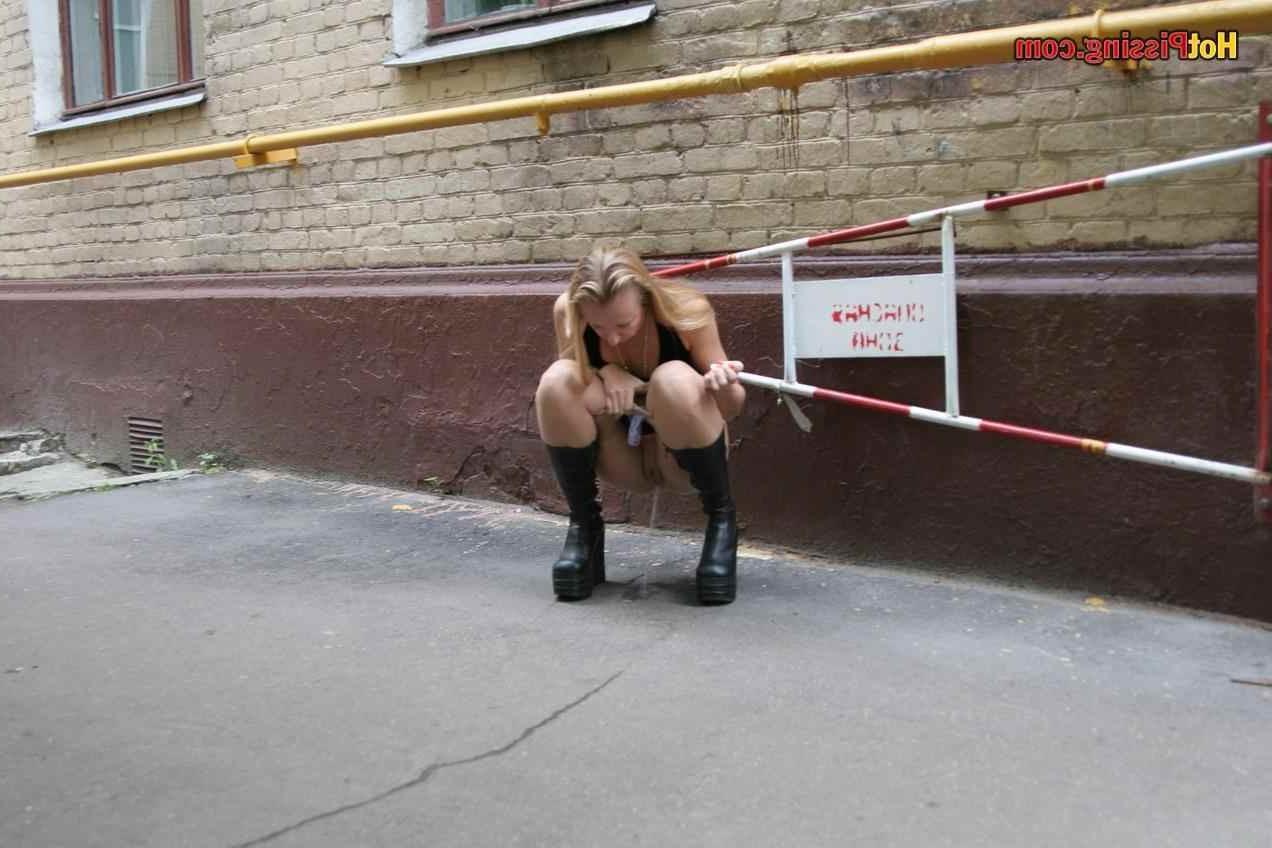 15P Slut pissing outdoors