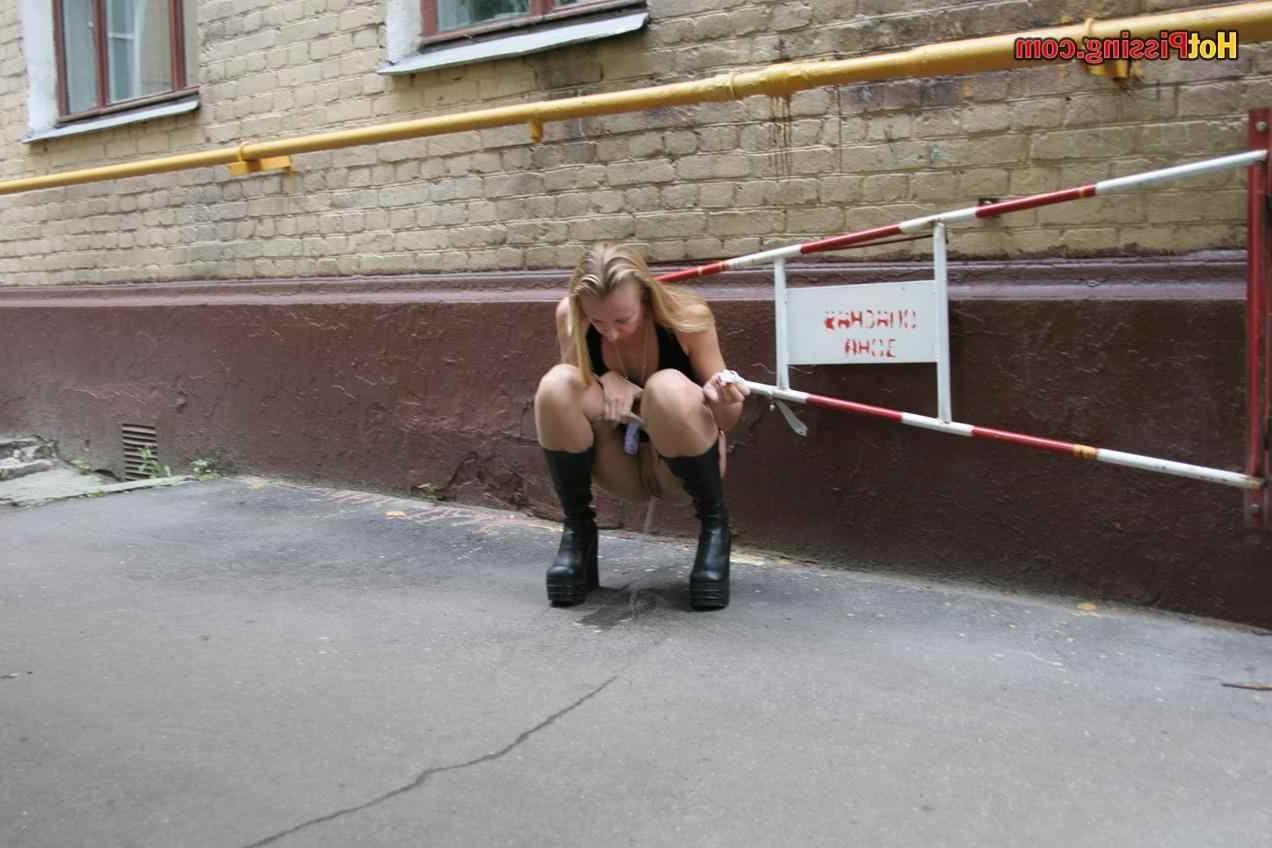 15P Slut pissing outdoors