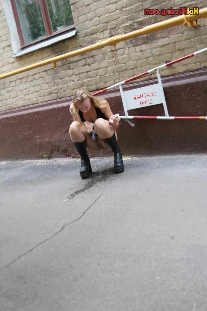 15P Slut pissing outdoors