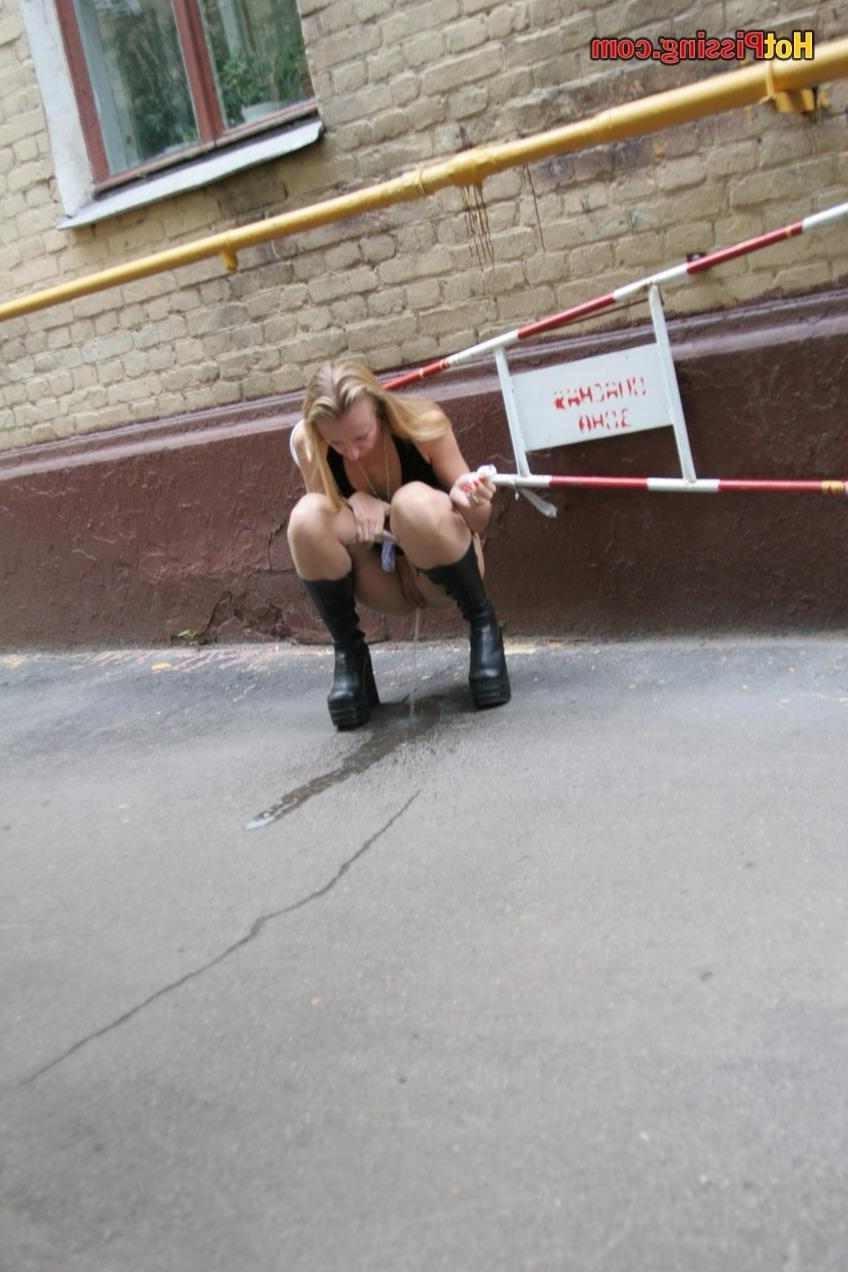 15P Slut pissing outdoors