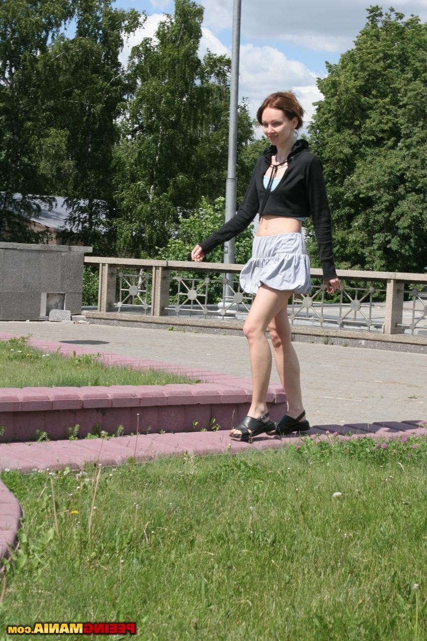 15P Miss in a pleated skirt pees thru the aquamarine panties in the street