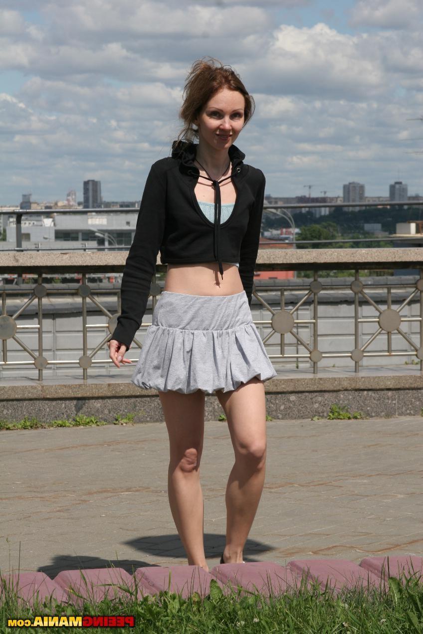 15P Miss in a pleated skirt pees thru the aquamarine panties in the street