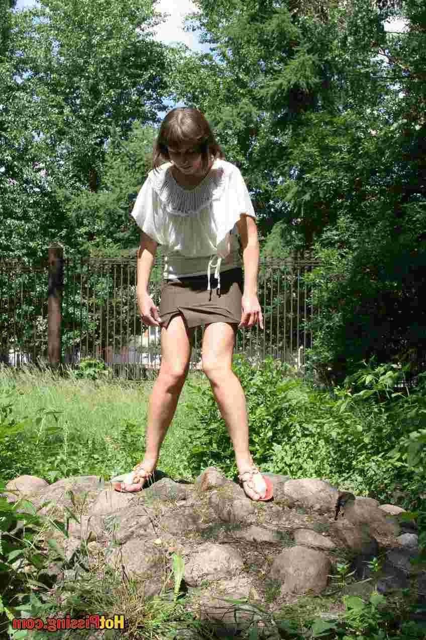 15P Slut pissing outdoors