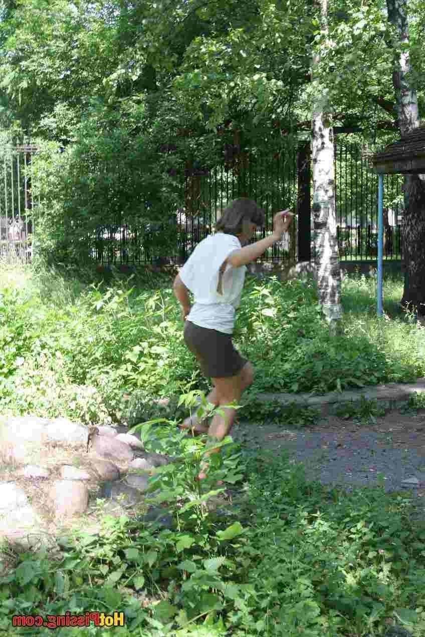 15P Slut pissing outdoors