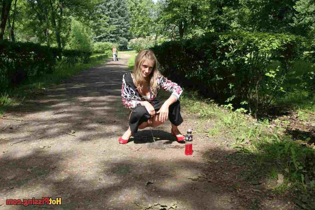 15P Slut pissing outdoors
