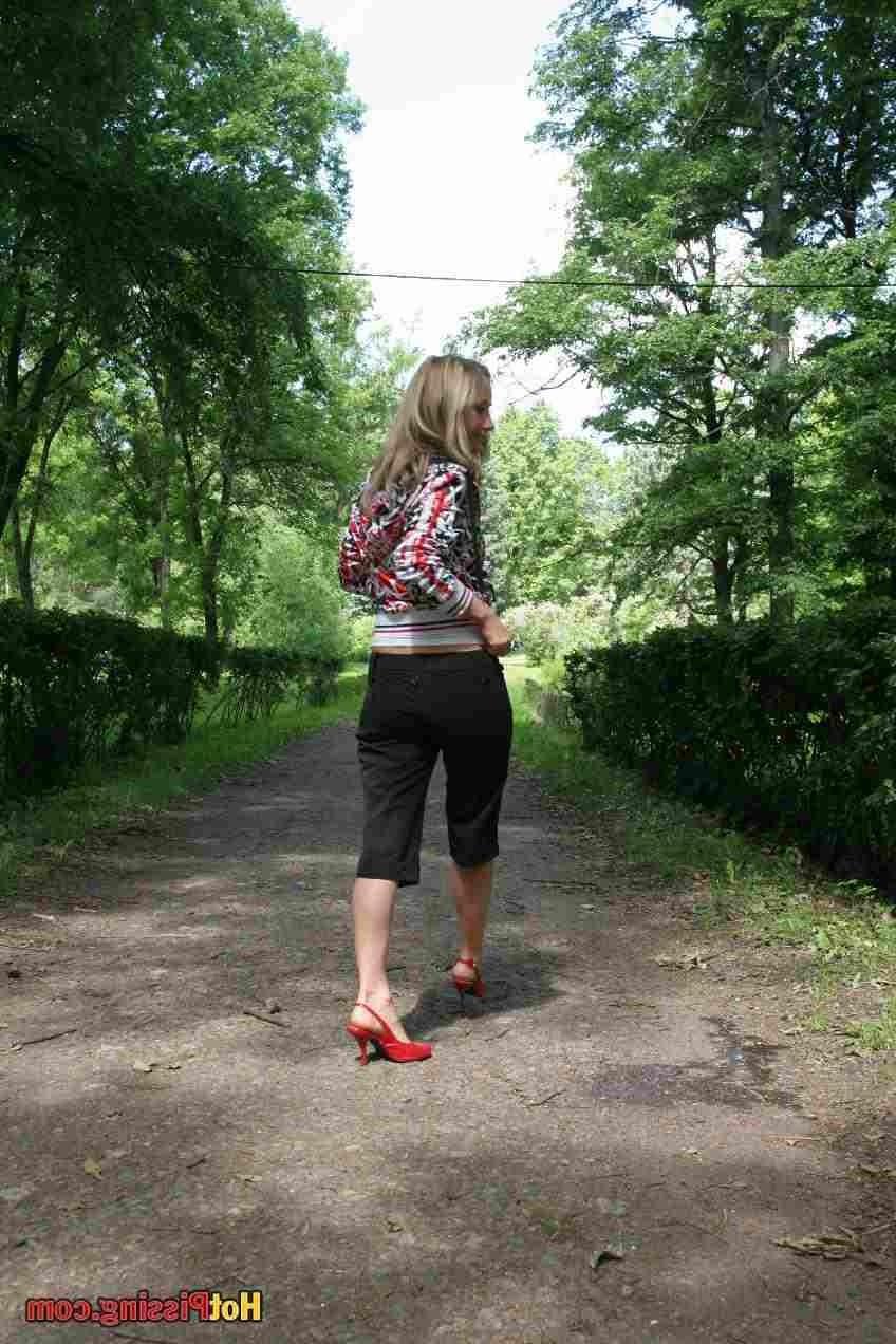 15P Slut pissing outdoors