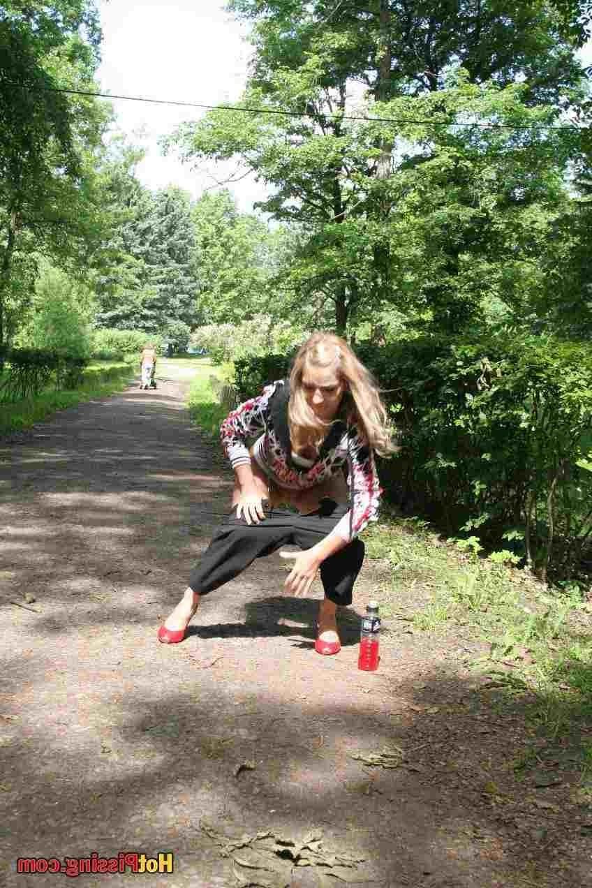 15P Slut pissing outdoors