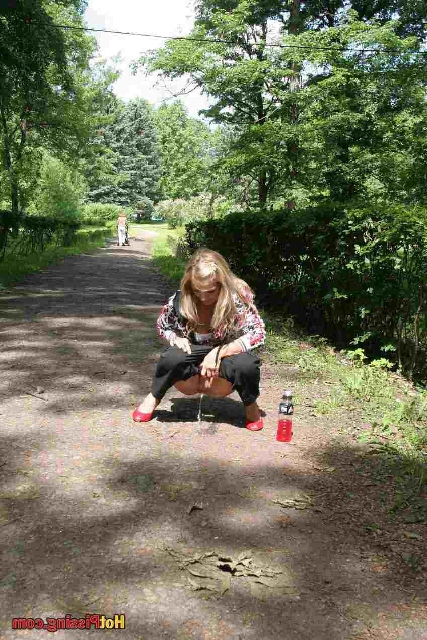 15P Slut pissing outdoors