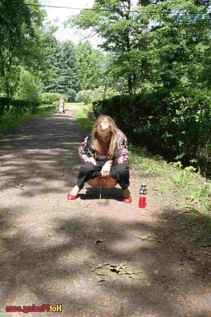 15P Slut pissing outdoors