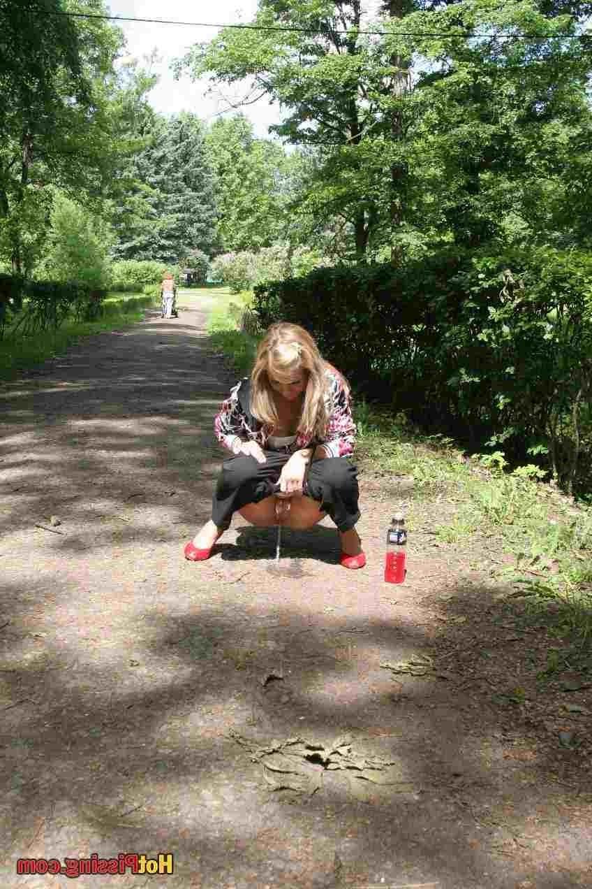 15P Slut pissing outdoors