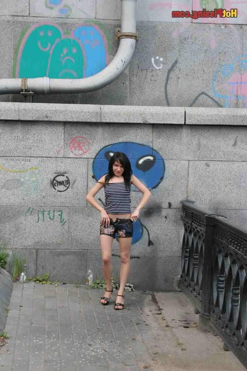 15P Slut pissing outdoors