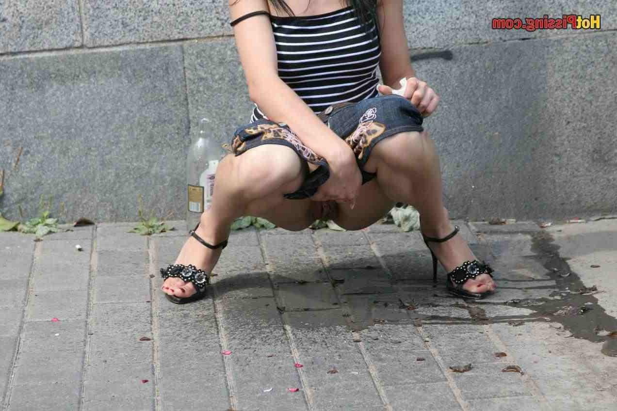 15P Slut pissing outdoors